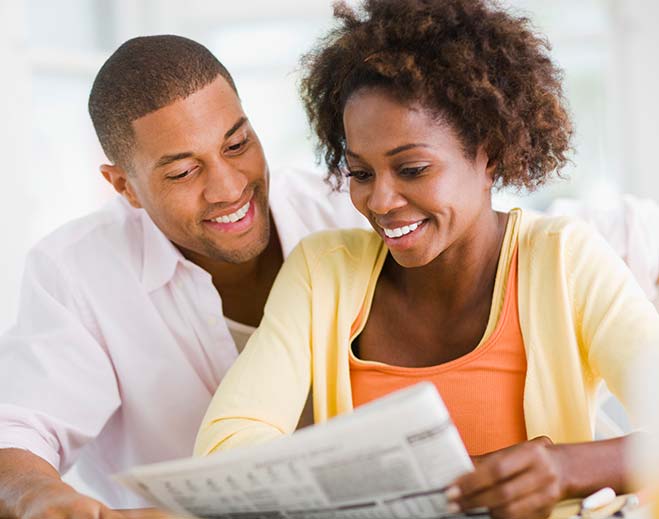 young-couple-reading-newspaper